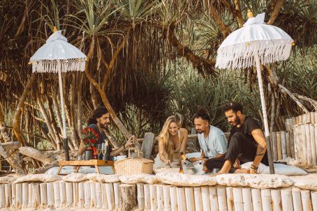 Beach picnic under white Balinese umbrellas at Nyang Nyang