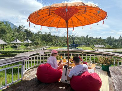 Picnic deck above the Jatiluwih rice terraces, helicopter parked beyond